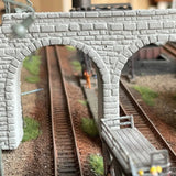 Gray brick n scale stone tunnel portal with detailed mortar lines and arch opening for model railway scenery
