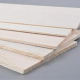 Light-colored balsa wood sheets with visible grain and smooth unfinished surface