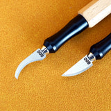 Two precision leather carving tools with black ergonomic handles and silver curved emery file blades from 100Shiki