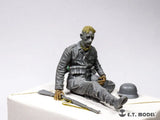Gray seated soldier with 3D-printed hands for 1/35 scale modeling