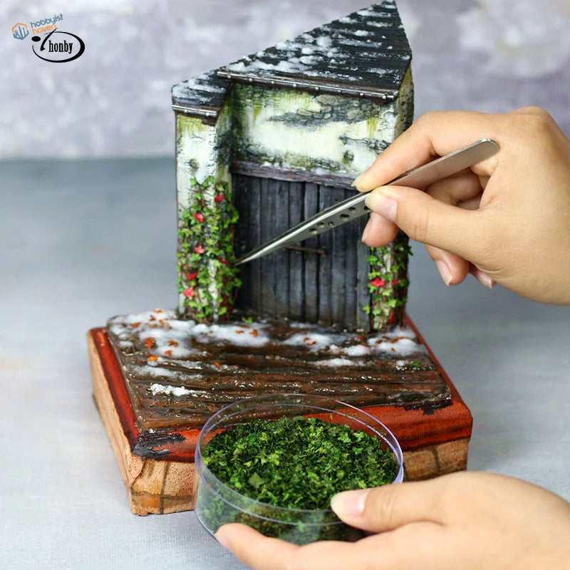Rustic shed diorama with colorful leaves for scale modeling