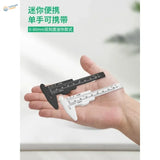 Compact 80/150mm plastic caliper with dual-scale black and white body