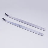 Silver curved-tip tweezers on 600#/1000# precision angled file