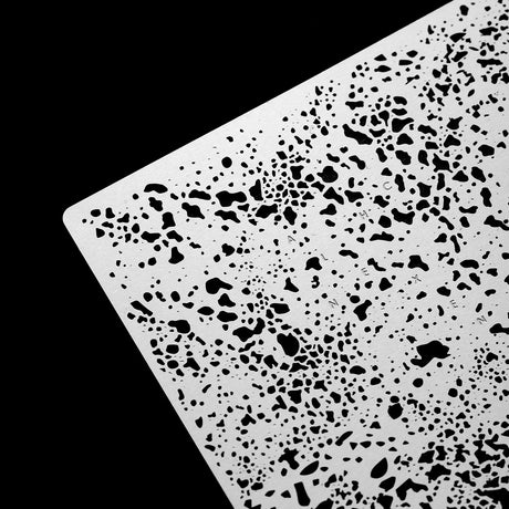 White plastic salt weathering corrosion stencil with black speckled terrazzo pattern for precision hobby tools