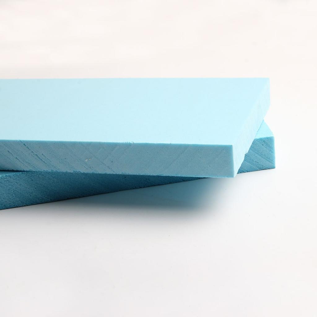 Light blue rectangular foam slabs with smooth textured surface and edges