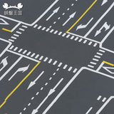 Close-up of road junction markings with arrows and zebra crossings