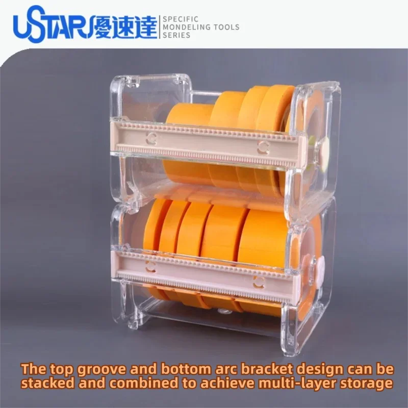 Clear plastic two-tiered ustar masking tape dispenser holding multiple rolls of bright orange masking tape