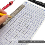 A transparent abs plastic modeling sheet with blue grid markings and a metallic ruler on a cutting mat