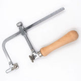 Adjustable wire saw with silver metal frame, light brown wooden handle, and medium-tooth blades rated for precision cutting kit includes 12 blades