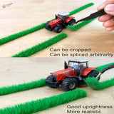 Red black Massey Ferguson toy tractor on 9mm static grass strips