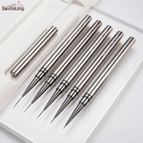 5 ultra-fine liner brushes laid out with their protective cap, showing the needle-fine bristle tips