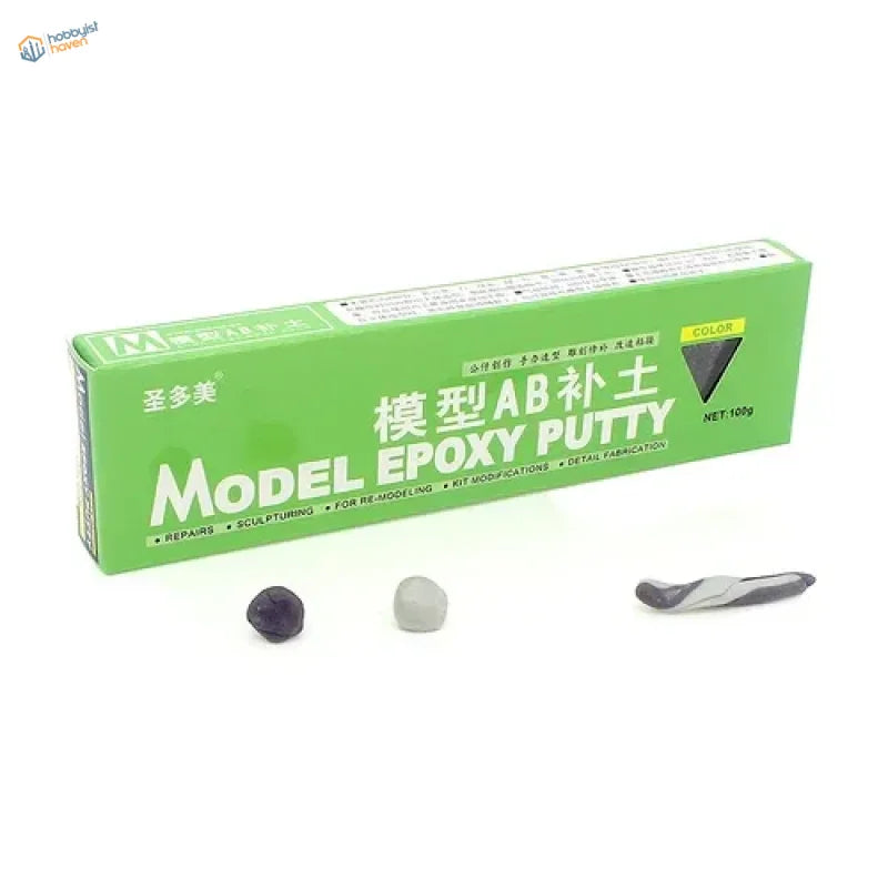 Green box of AB epoxy putty with black gray and silver-gray samples for scale modeling tools and scale model use