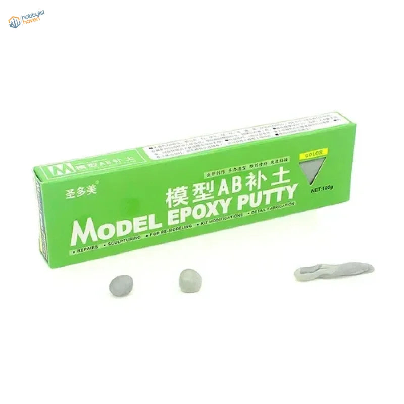 Green rectangular box of ab epoxy putty with white text and gray putty samples for scale modeling tools and scale model use