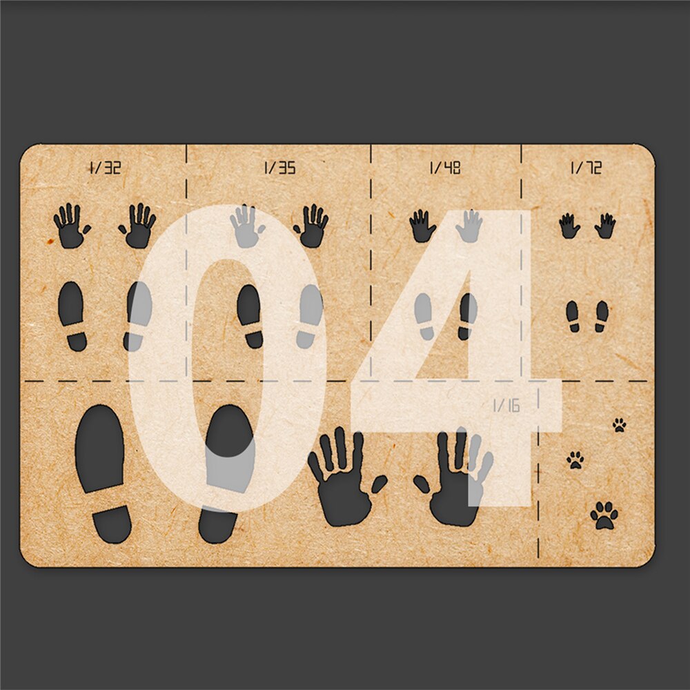 Brown cardboard paw print stencil with black gray hand foot cutouts for 1/16 to 1/72 scale models