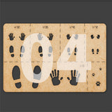 Brown cardboard paw print stencil with black gray hand foot cutouts for 1/16 to 1/72 scale models