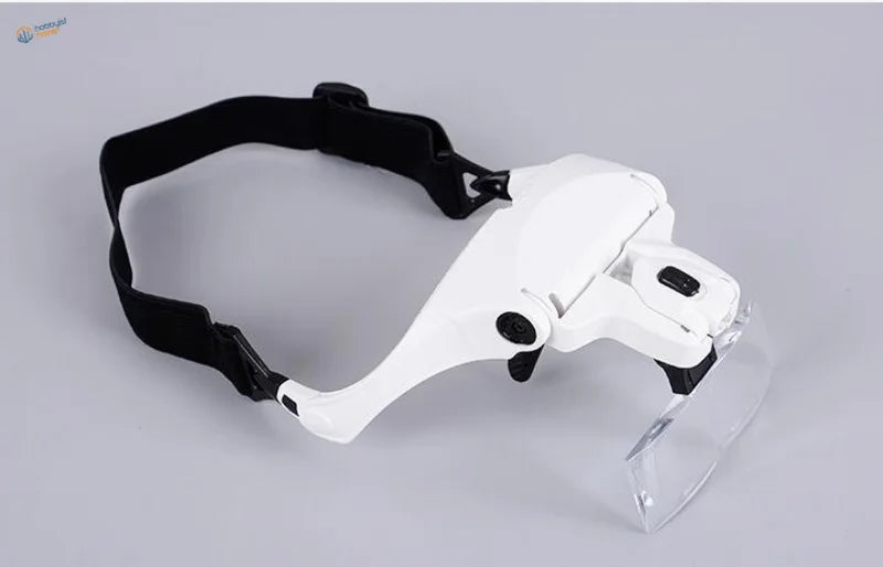 White LED light headband magnifier with adjustable black strap