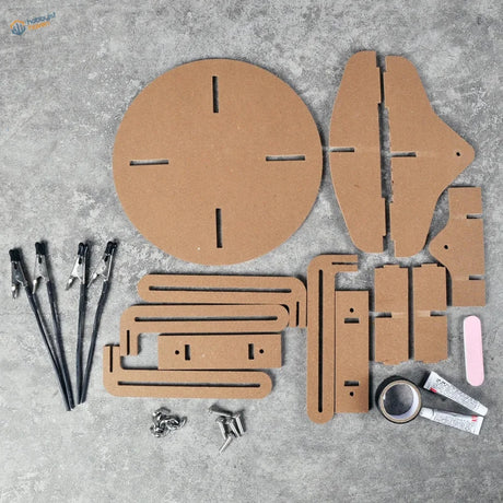 Brown cardboard components of an adjustable model assembly and painting stand diy craft kit for scale modeling tools