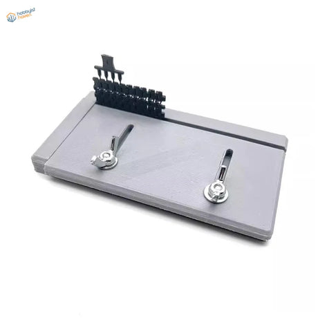 Gray adjustable track building jig with knobs and attachment rack