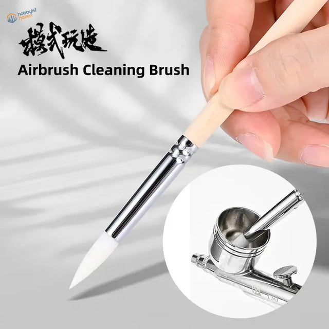 Sleek airbrush cleaning brush with light wood handle and white bristles