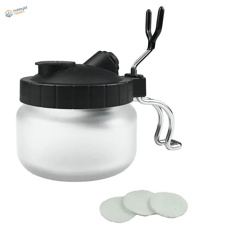 Transparent frosted glass airbrush cleaning pot sprayer with black lid, handle and 3 white filters