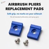 Two blue soft replacement jaw pads with their mounting screws for Shanhai airbrush maintenance pliers