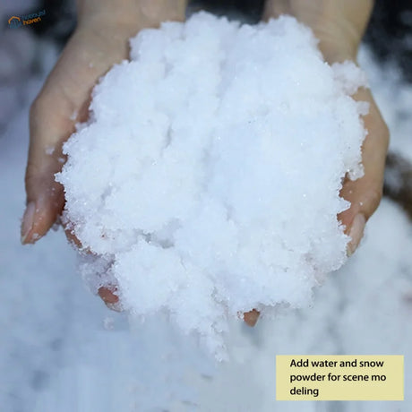 Fluffy white artificial snow powder cradled in cupped hands