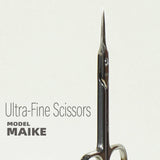 Close-up of the long needle-like tip of the MAIKE D25 scissors