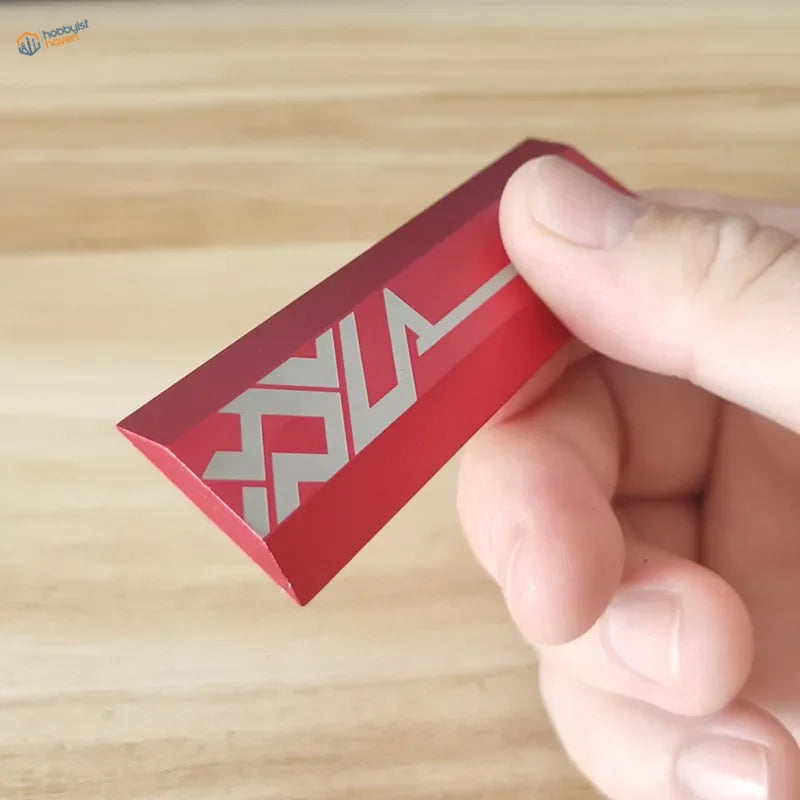 Red beveled edge sanding plates keychain with silver geometric logo