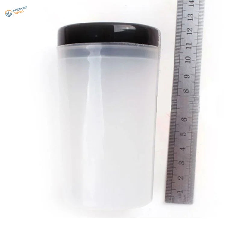 Transparent brush cleaning bottle with black lid