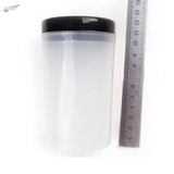 Transparent brush cleaning bottle with black lid