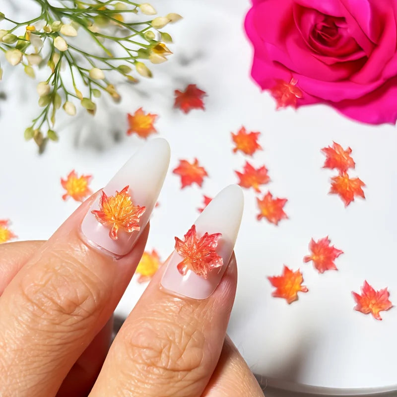 Delicate orange yellow red maple leaves decals on long white almond nails
