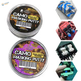Two circular metal tins of camouflage masking putty labeled zero black color and blue queen color for soft-edge camouflages