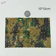 A rectangular piece of camouflage netting fabric with green black and tan woven design for flexible cloth train layouts