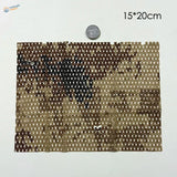 Camouflage netting fabric for scale dioramas featuring flexible cloth with brown digital camouflage and chain-like motifs