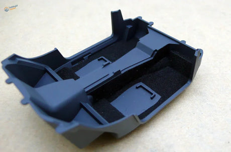 Black car interior flocking liner with molded compartments and foam padding