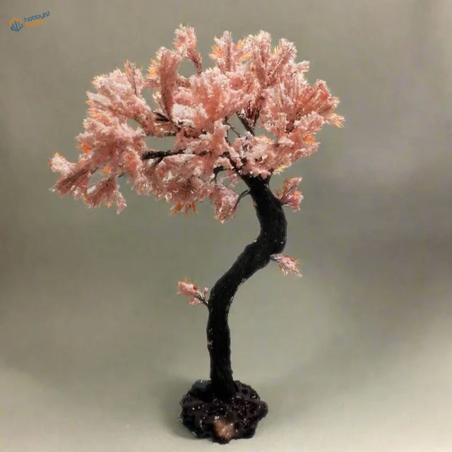 Delicate pink beaded scale model cherry blossom tree with dark twisted trunk