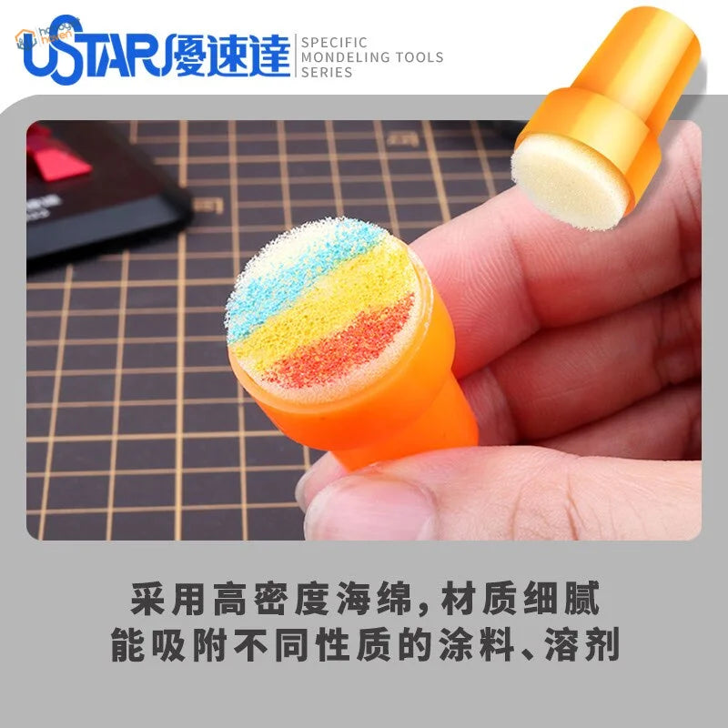Orange-handled chipping sponge brush for scale modeling with colorful tip