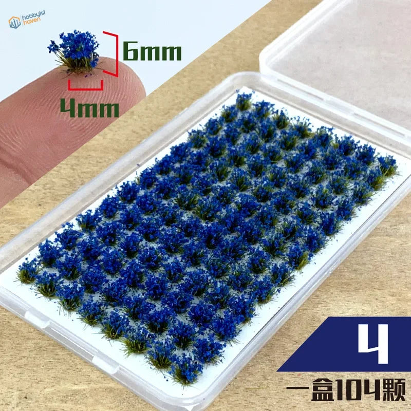 Colorful grass patches with 104 miniature blue flowers in clear container