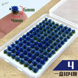 Colorful grass patches with 104 miniature blue flowers in clear container