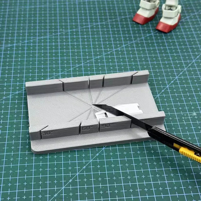 Gray 3D-printed angle ruler on precision hobby tool cutting jig