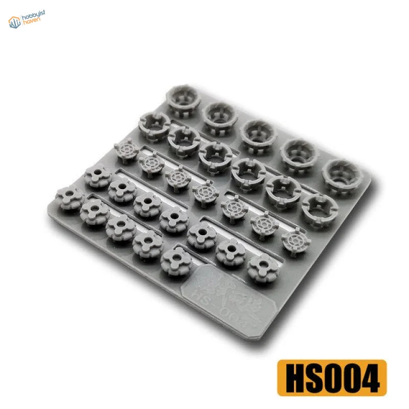 Gray plastic tray of detailing parts for Gunplas with star and gear models