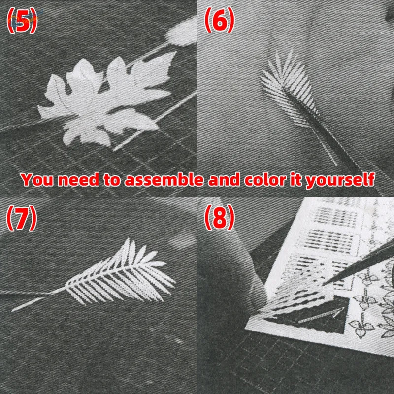 White paper leaf cutouts with detailed vein patterns for diorama jungle plants using precision hobby tools