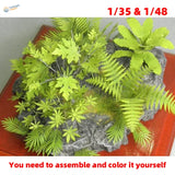 Diorama jungle plants lime-green plastic foliage set on gray rock base for scale modeling tools and precision hobby tools