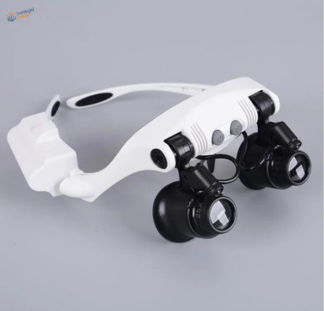Double-eye magnifier with adjustable LED head lamp, front view