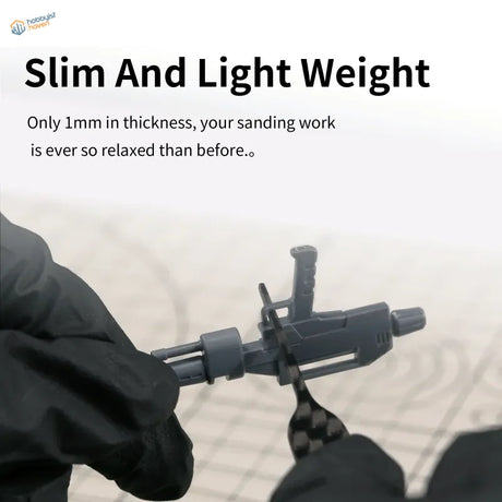 Gray plastic firearm model on DSPIAE carbon fiber sanding plates
