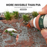Mud-textured glue on a diorama base with a grass tuft placed with tweezers