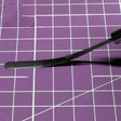 Black elastic spatula with curved polished tool and sturdy handle for scale modeling