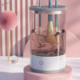 Electric brush cleaning machine with transparent cylinder holding blue brushes