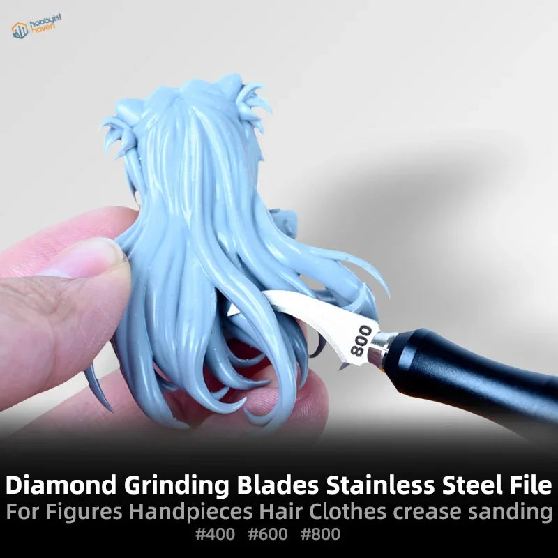 Emery blades sanding light blue figurine hair for scale modeling
