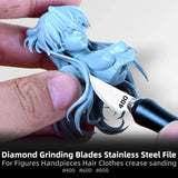 Sanding light blue resin anime figure head with #400 emery blade for scale modeling